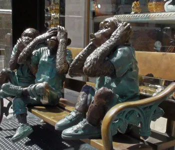 Three monkeys covering their eyes, ears, and mouth.